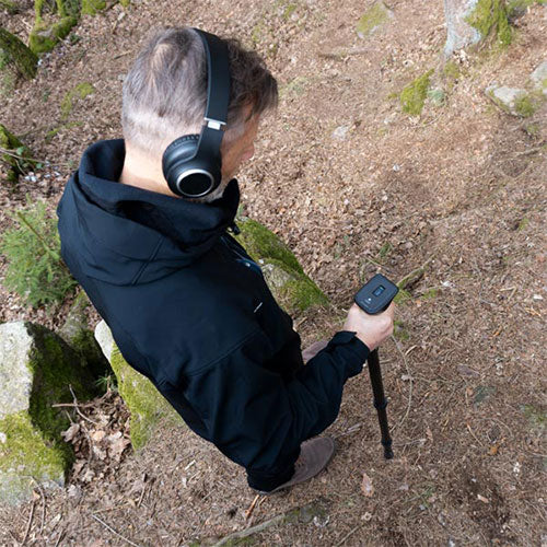 A top down view of a man using the OKM Rover UC groundscanner 