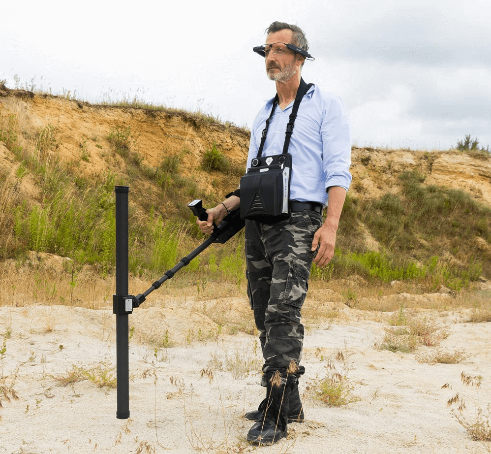 A man metal detecting with the OKM eXp 6000 Professional Plus